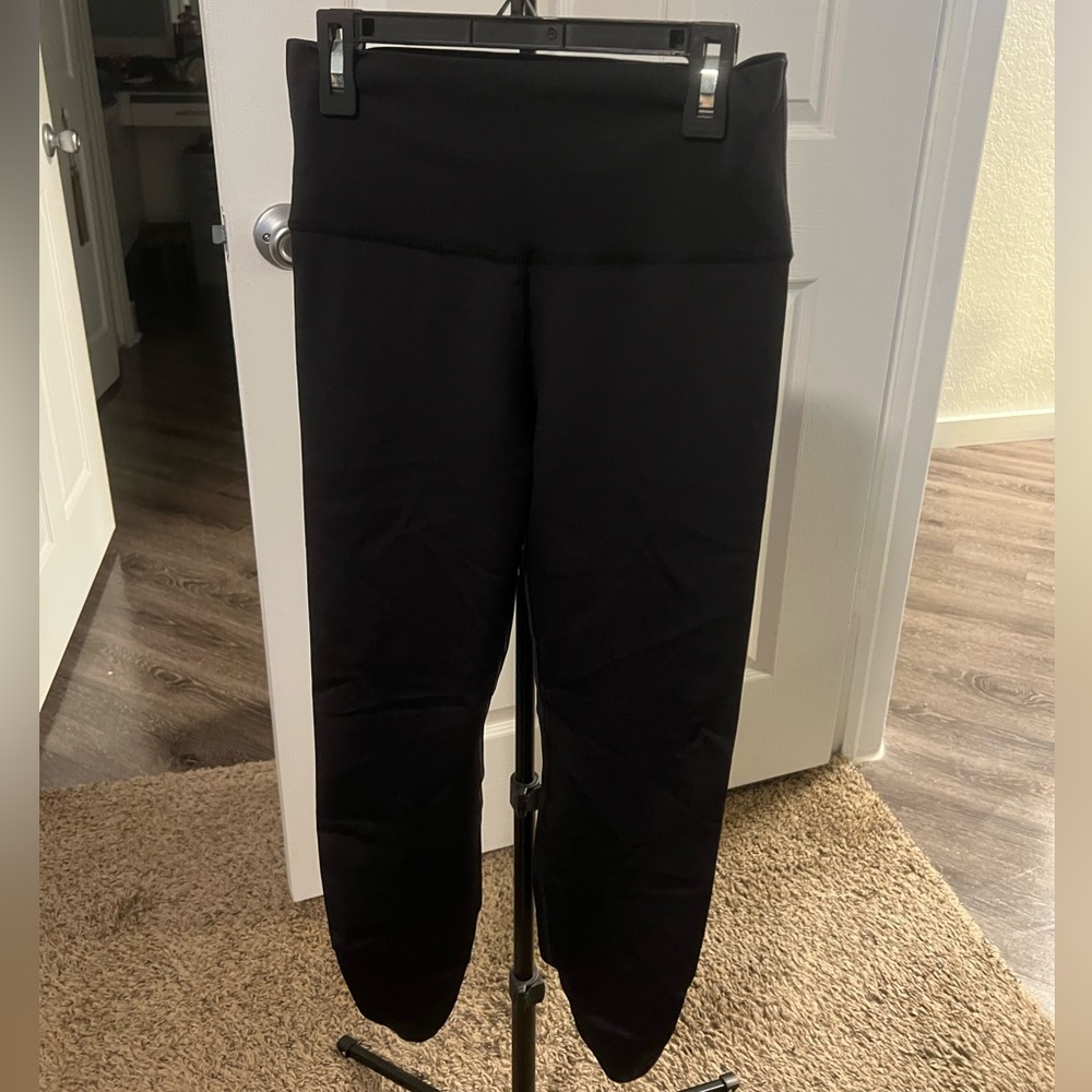 Nike leggings, black, size medium, scrunch detail on back of the calf.